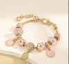 Pink Flower And Leaf Shaped Round Charm Bracelet