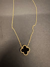 STAINLESS STEEL NECKLACE WITH BLACK, WHITE OR BLUE ENAMEL FLOWER PENDANT