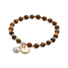 Beaded elastic bracelet with light smoked topaz rhinestone charm and disc available in different versions