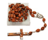 catholic rosary beads made of wood with a wooden cross with metal corpus