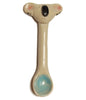 a small pale coloured ceramic spoon with a coloured bowl and the face of a koala on the end of the handle
