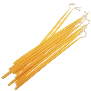 12 long thin yellow beeswax taper candles approximately 23cm long
