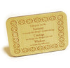 A small rectangular standing plaque made of wood etched with the serenity prayer and a four leafed clover design around the edge